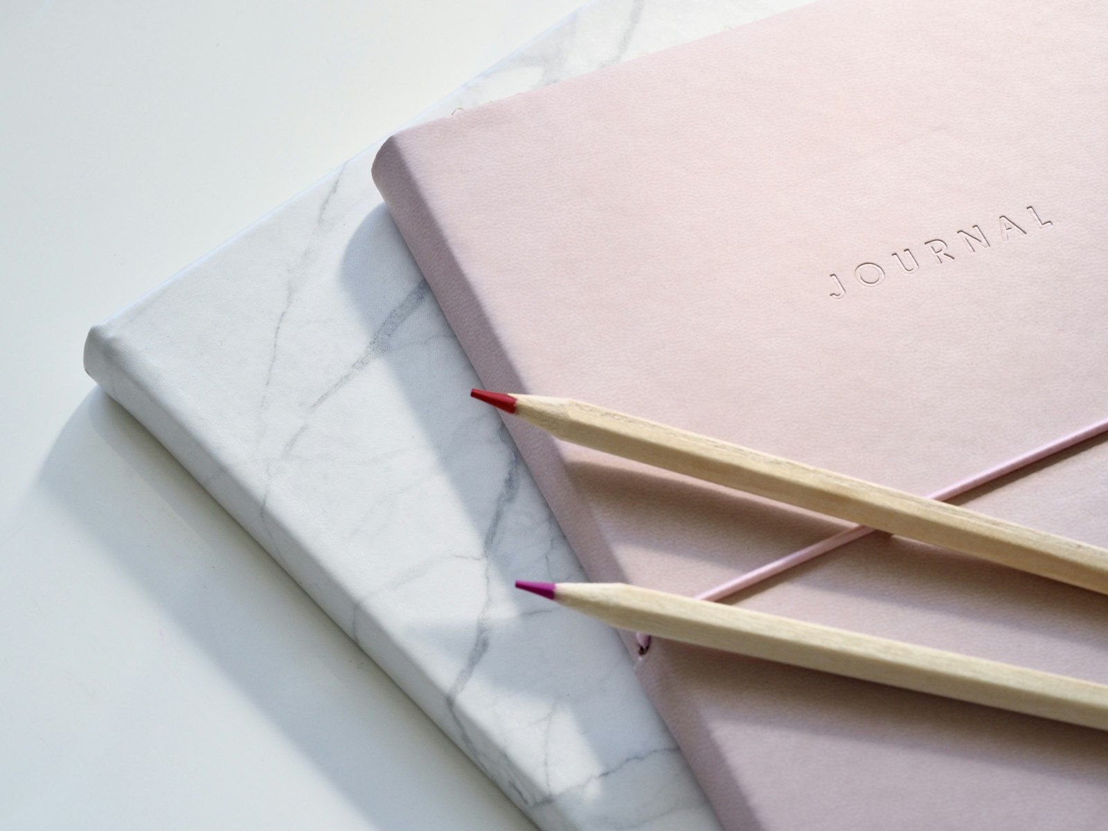 Field Notes journal cover on marble
